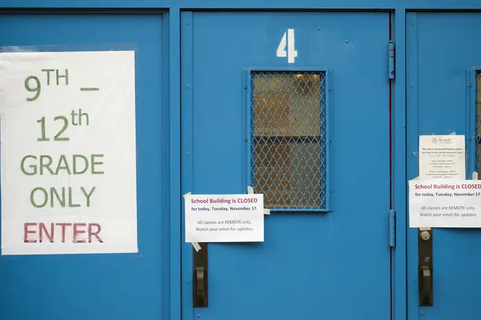 Signs on the doors of a closed public school in Brooklyn on November 18th, 2020.